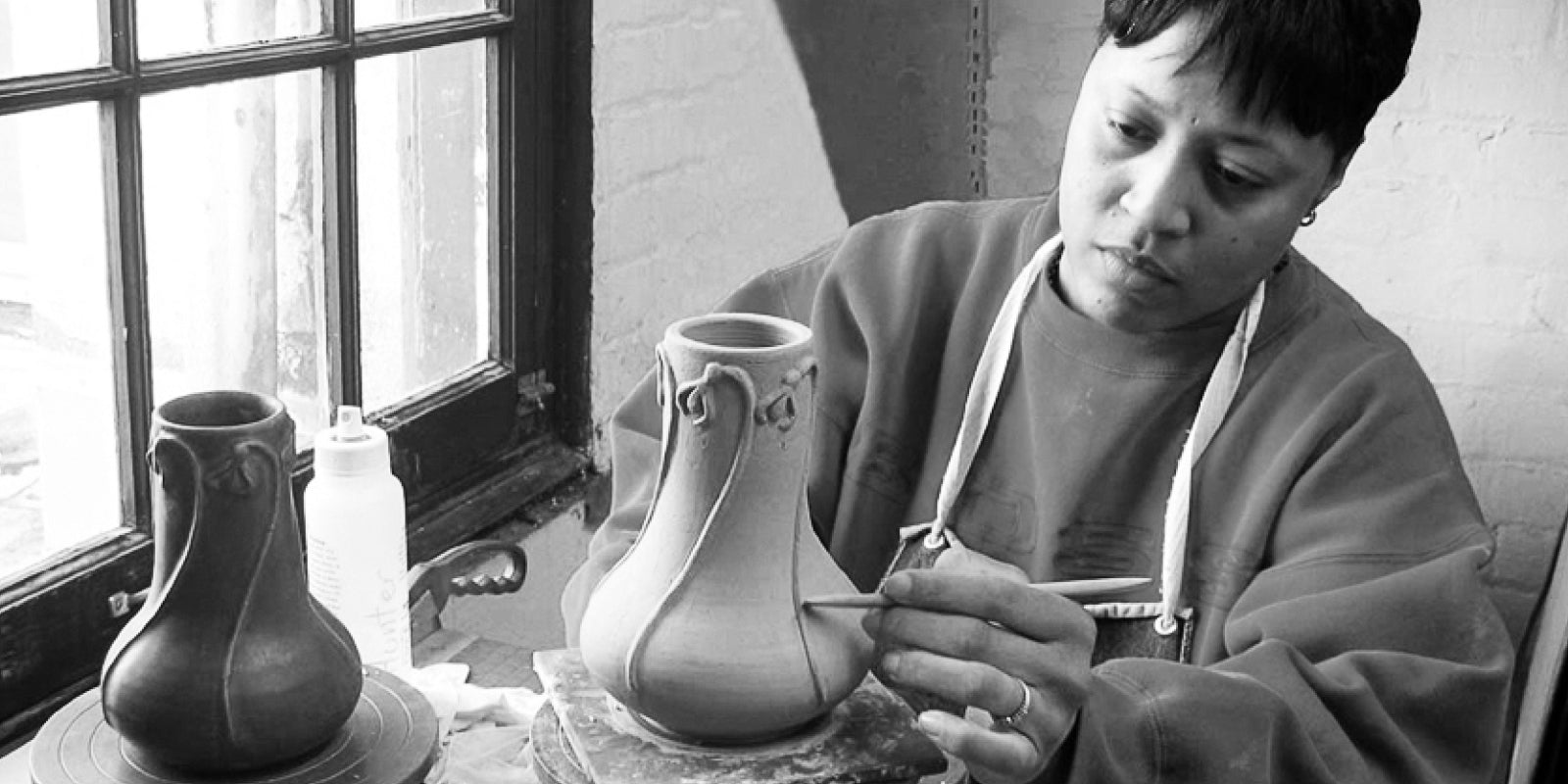 Master Mold Maker Sherlyn sculpting what would become the Snowdrop vase in production present-day.