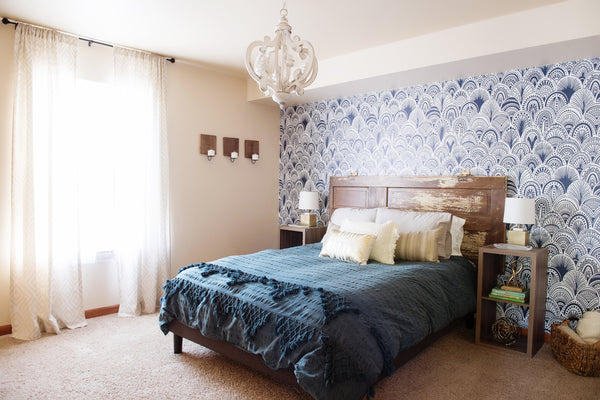 Blue bedroom with wallpaper feature wall