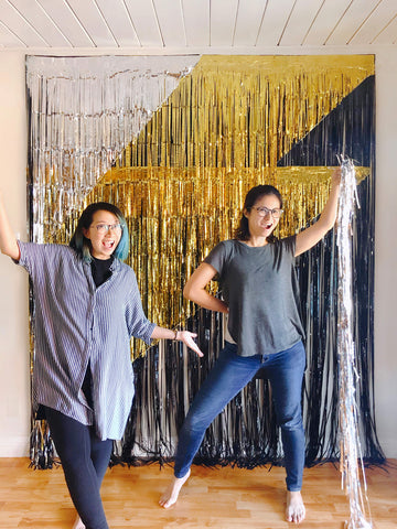 momo party owners finishing the black gold sliver fringe curtains made giant lighting bolt icon photo booth backdrop