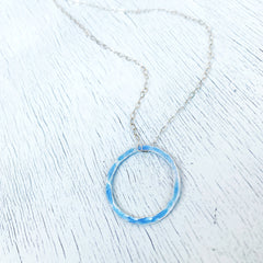 light blue fine silver enamel open circle karma necklace with sterling silver chain
