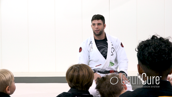 Marcus Buchecha Almeida chatting with young Brazilan Jiu Jitsu Athletes about Cauliflower ear and Cualicure