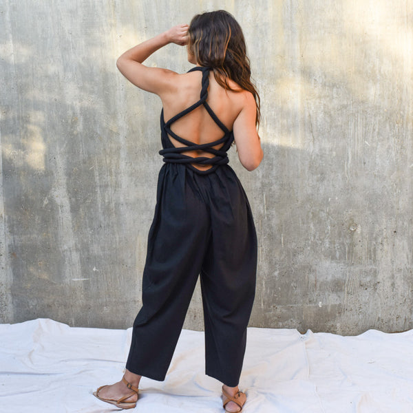 black jumpsuit with feathers