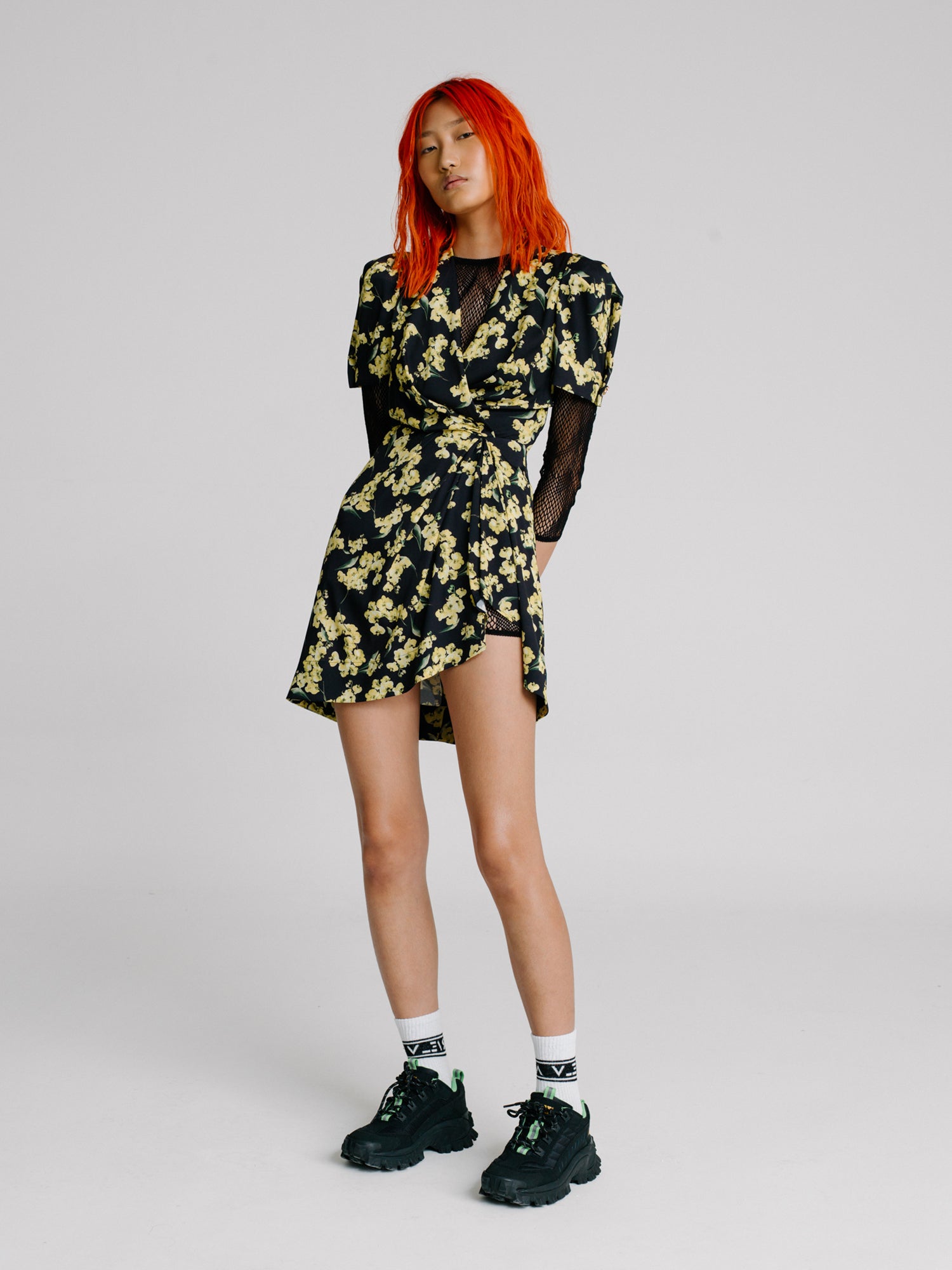 Red hair girl wearing a black floral dress