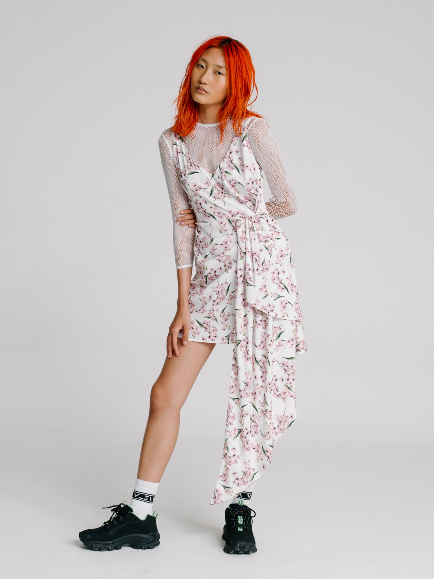 Red hair girl wearing a white floral dress