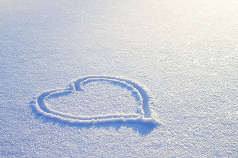 heart shaped drawing in the snow