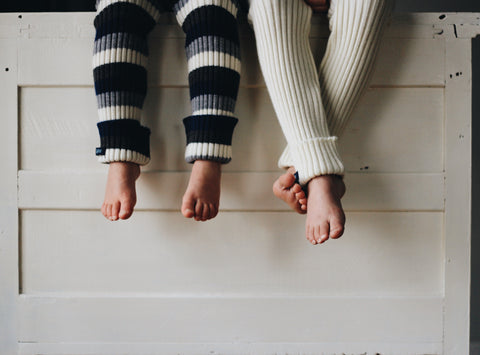 2 kids wearing wool tubes leggings