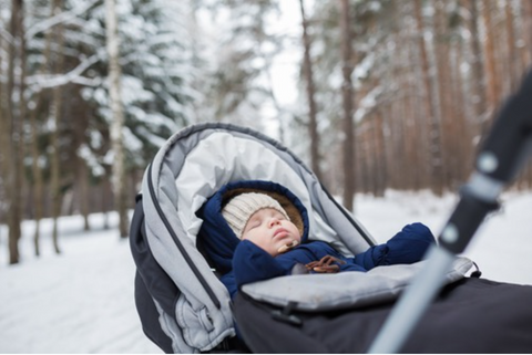 a baby boy napping outside