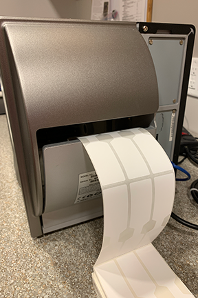 Fanfold Labels Loaded Into A Thermal Printer Through The Rear Slot