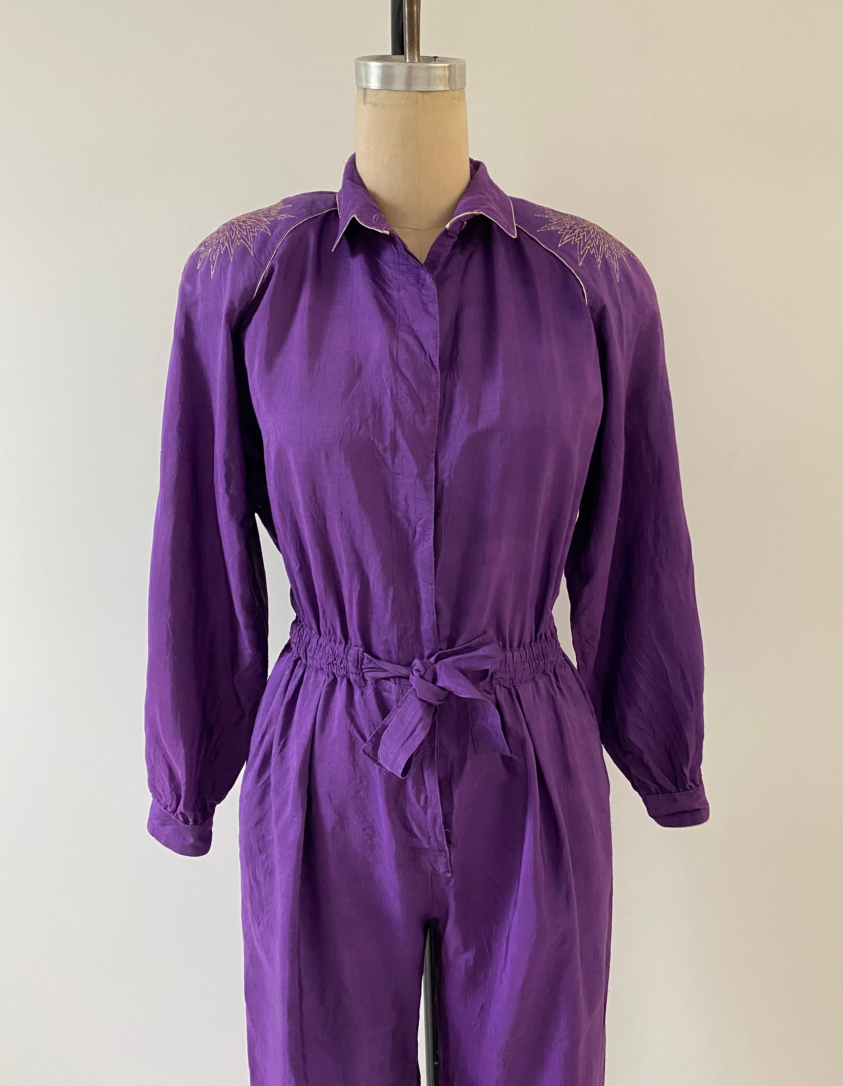 purple 80s jumpsuit