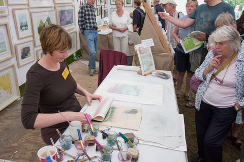 Laura Boswell doing a demo at an art fair