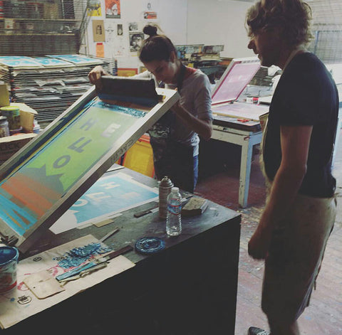 Two artists screenprinting at Mission Grafica - San Francisco