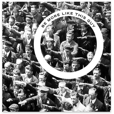 August Landmesser standing arms crossed amidst the Nazi salute.