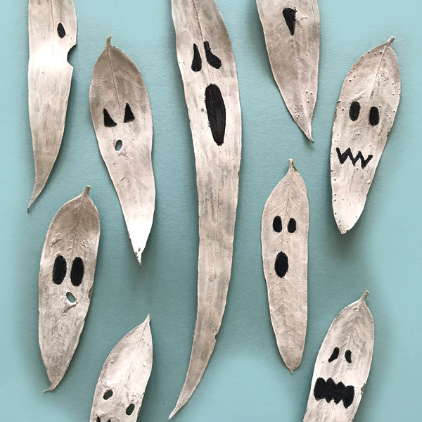 Fun painted leaves made into ghost decorations