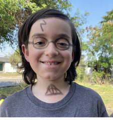boy with harry potter face paint