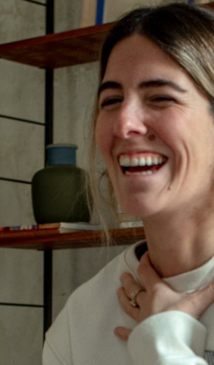 Woman shown from shoulders up with a huge smile on her face. There’s a feeling of excitement and joy. She appears to be laughing. The text reads “Are you ready to take the first step?” Yellow “Join Now” button beside the image.