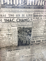 black and white travel photo Vietnamese newspaper