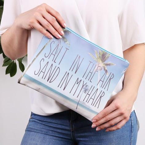 https://www.thebeachcompany.in/collections/beach-bags/products/palm-tree-slogan-clutch-bag