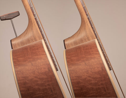 adjustable action on an acoustic guitar in use. Left is higher, right is lower. 