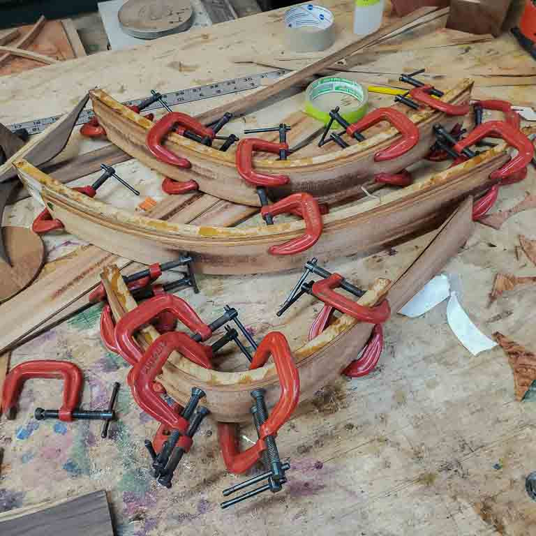 clamping the braces into the mold to make sure they stay in shape