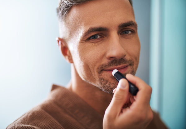 man using lip balm