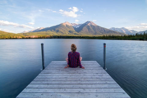 Woman Looking at a Lake Living a Healthy Lifestyle