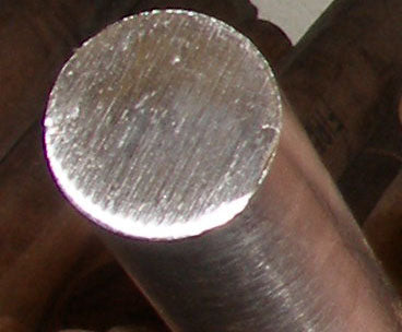 Round cylindrical bar of solid titanium used to cut out titanium rings