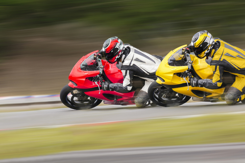 Motorcycle rallies and competitions have the energy of competition and education.