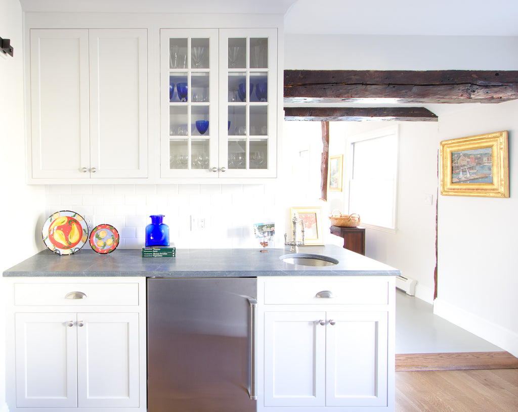 kitchen hutch exposed beam white medallion cabinetry blue vase