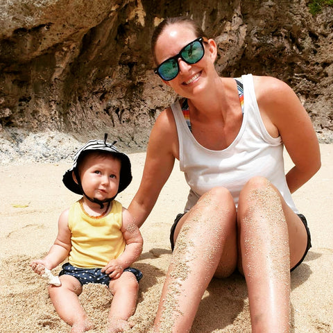 Krystal and daughter enjoying some Vitamin D at His Beach in Niue