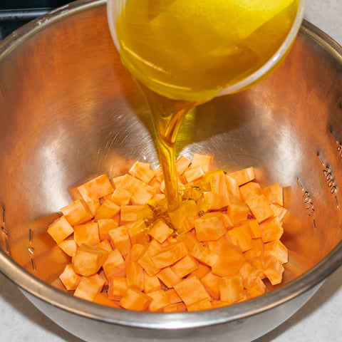 toss potato cubes with olive oil