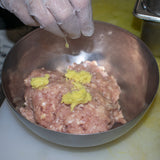 in a bowl add ground chicken or turkey with minced fresh ginger