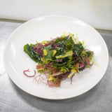 Arrange the seaweed salad on two plates