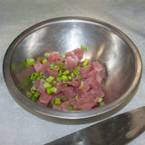 add minced scallions and tuna in bowl