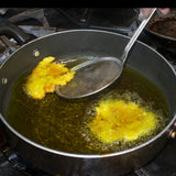 arefully add the plantain disks to the oil and fry until golden brown