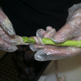 Wrap the bacon in a spiral around each asparagus stalk