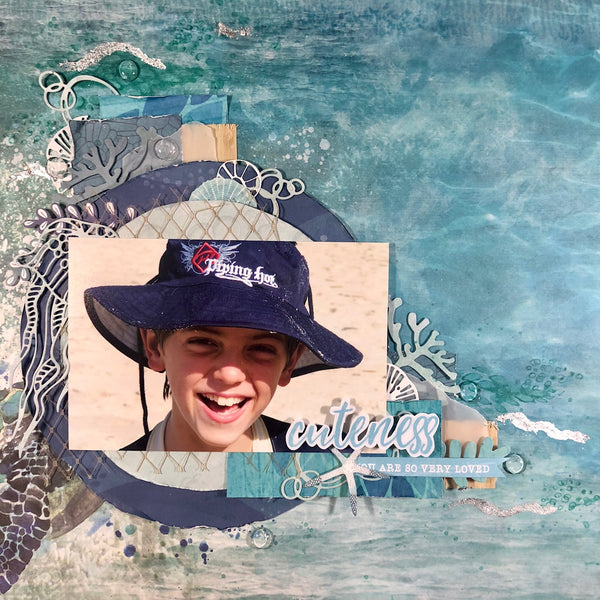 Scrapbooking layout of a young boy on the beach - travel layout