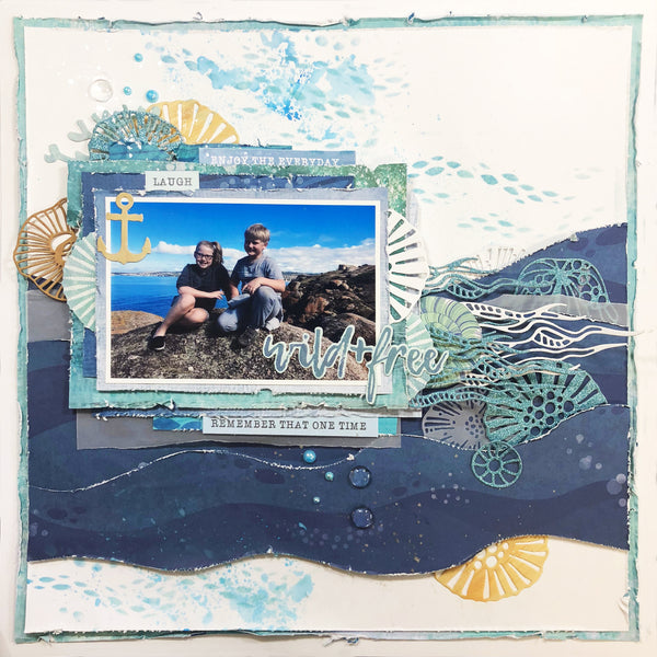 two kids sitting on a rock on vacation at the beach scrapbooking layout