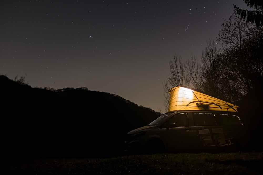 Van camping under the stars
