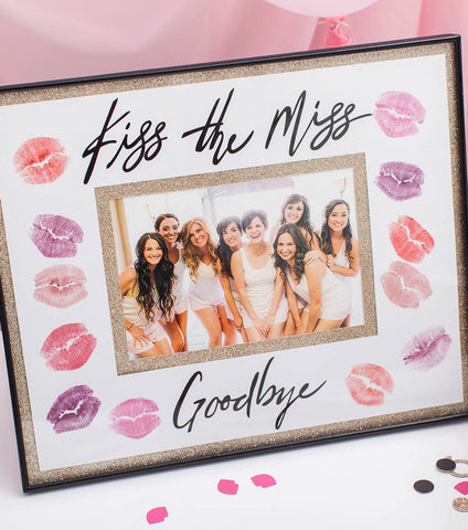 Picture frame with words Kiss the Miss Goodbye with lipstick prints around edge
