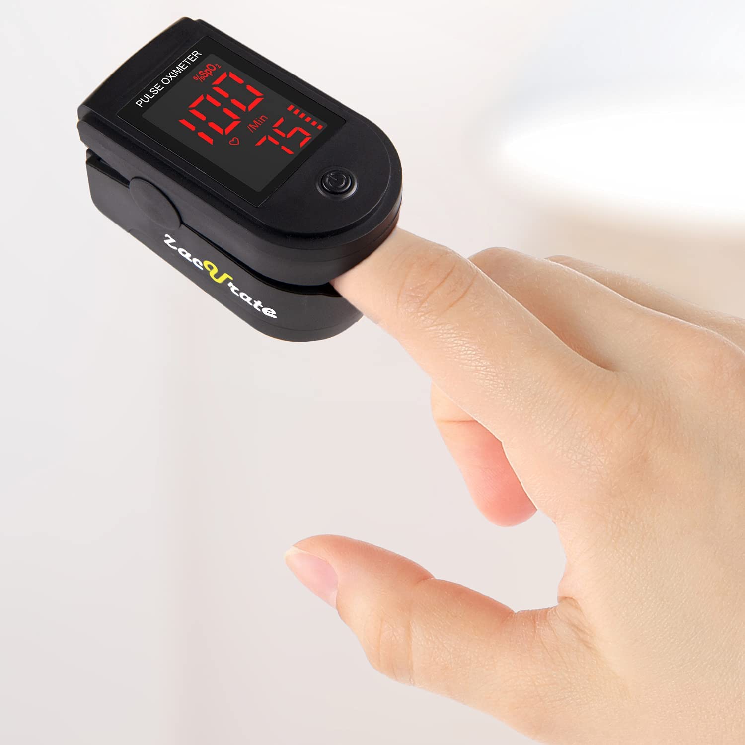  A close-up view of a finger inside of the black Zacurate 500DL Pro Series Pulse Oximeter 