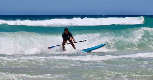 sup paddleboard ocean surf