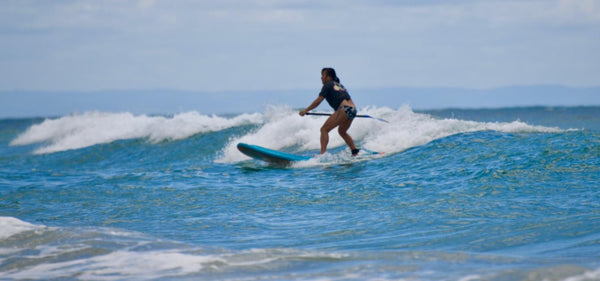 sup surfing ocean