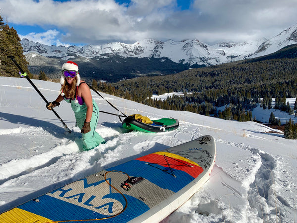 Woman SUP Mountains Colorado Snow Paddleboard Sled