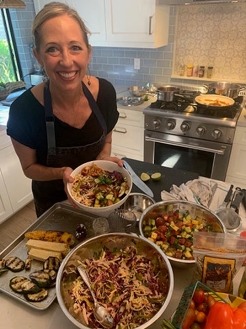 Chef Julie Frans holds a finished Summer BBQ Bowl. 