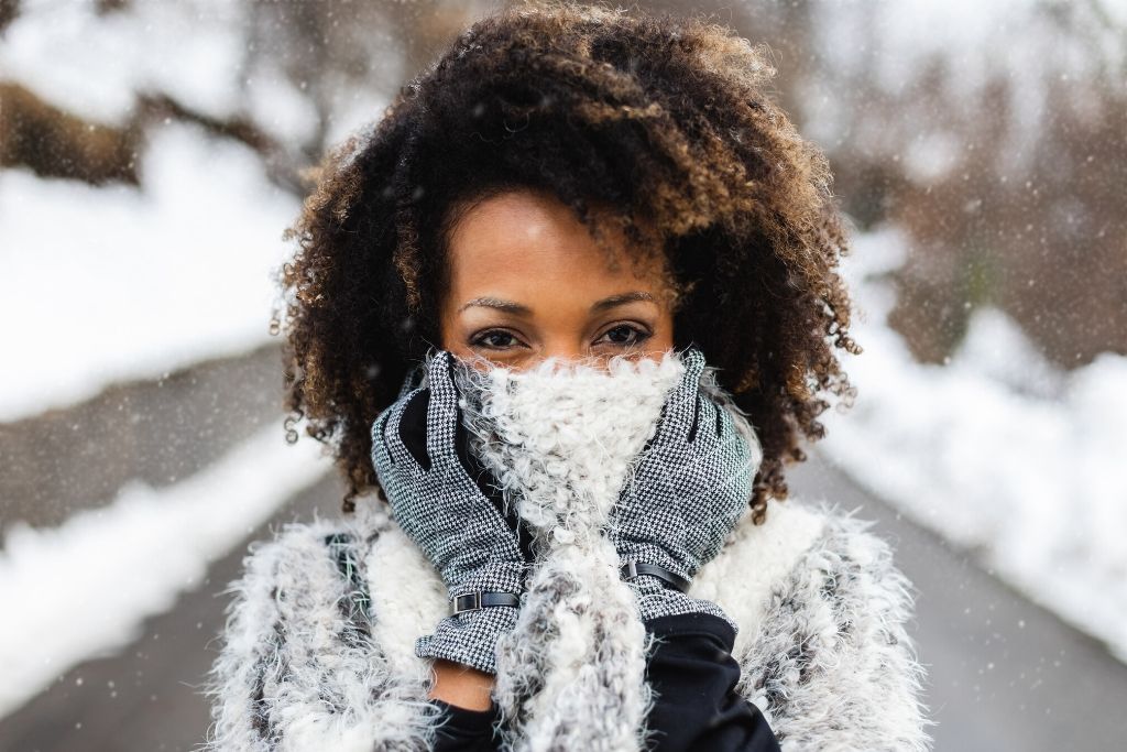Woman with curly hair outside in winter