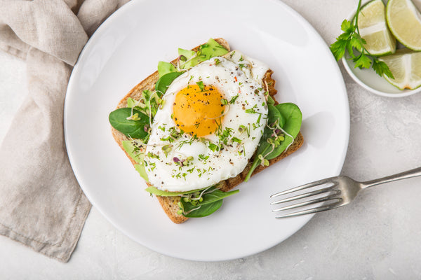toast with avocado, spinach and fried egg