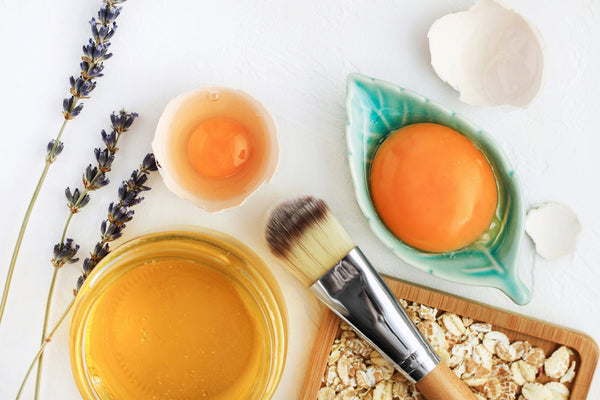 Bright egg yolks, oatflakes, honey mix for face mask