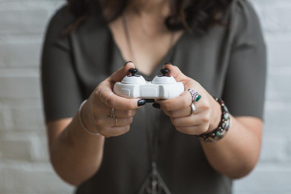 Close up of woman using a video game controller.