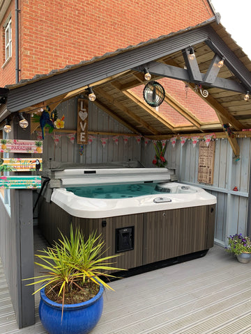 Hot tub with gazebo and Hawaiian decorations