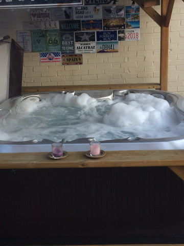 Hot tub with candles and bubbles